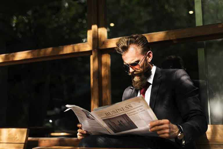 salesman reading a newspaper
