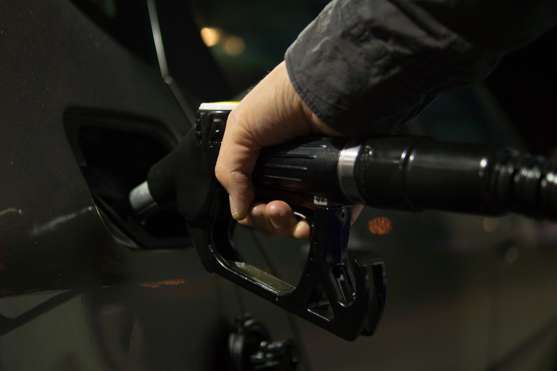 A person is fueling the car with gas 